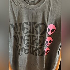 Dressed in Lala brand oversized “Weirdo” t-shirt